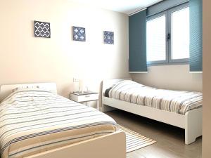 Postel nebo postele na pokoji v ubytování appartement Duna Beach