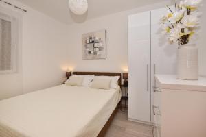 Postel nebo postele na pokoji v ubytování Apartman Luka