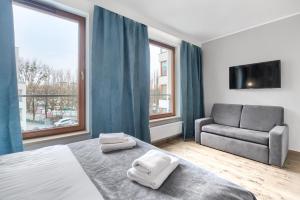 TV a/nebo společenská místnost v ubytování EXCLUSIVE Szczecin Apartment - 2 seperate bedroom 5 star Apartment *****