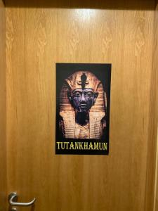 a door with a picture of a bust on it at Draz pyramids view Bed & breakfast in Cairo