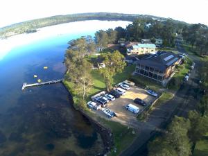 an aerial view of a house on an island in the water at Dungowan Holiday Accommodation in Erowal Bay
