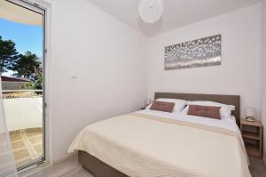 Postel nebo postele na pokoji v ubytování Apartman Mia