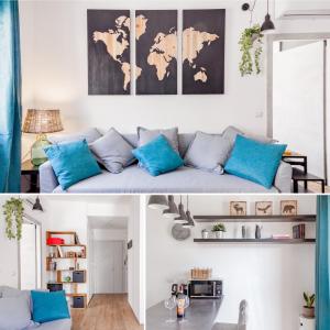 uma sala de estar com um sofá azul e um mapa do mundo em Open the Classic Wooden Shutters at a Cozy City Nest em Florença