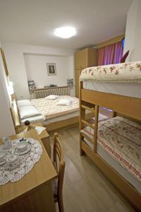 Postel nebo postele na pokoji v ubytování Hotel La Molinella