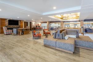 a lobby of a hospital with a couch and chairs at Holiday Inn Missoula Downtown, an IHG Hotel in Missoula