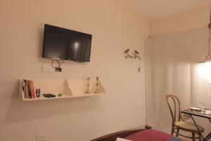 a living room with a tv on the wall at Loft para 2 personas in San Salvador de Jujuy