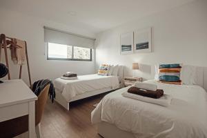 מיטה או מיטות בחדר ב-9 Furnas Villa