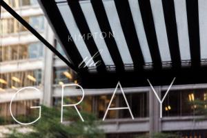 a view of a bridge with two chairs in front of a building at Kimpton Gray Hotel Chicago by IHG in Chicago