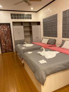 Postel nebo postele na pokoji v ubytování Monallan Boracay Hotel + 37 fotografií