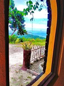 a view of the ocean through a window at Kamp Aninipot in Siquijor