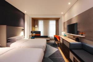 Postel nebo postele na pokoji v ubytování Holiday Inn Express Hefei Shushan by IHG