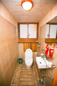 a bathroom with a toilet and a sink at Bukchonmaru Hanok Guesthouse in Seoul