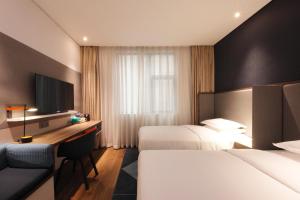 Postel nebo postele na pokoji v ubytování Holiday Inn Express Hefei Shushan by IHG