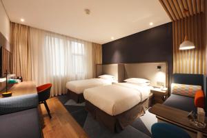 Postel nebo postele na pokoji v ubytování Holiday Inn Express Hefei Shushan by IHG