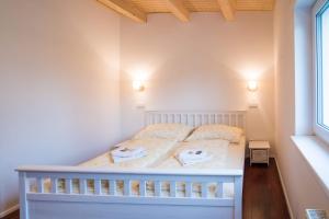 Posteľ alebo postele v izbe v ubytovaní Apartmány Habánská, celý dům