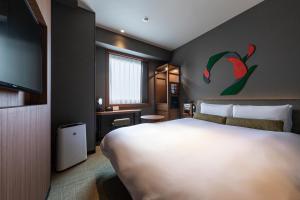 Postel nebo postele na pokoji v ubytování Hotel JAL City Haneda Tokyo