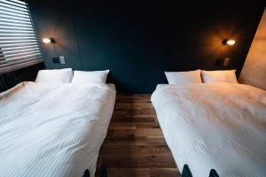 En eller flere senge i et værelse på mizuka Nakasu 1 - unmanned hotel -