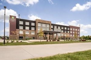 a large building with a road in front of it at Holiday Inn Express & Suites - West Des Moines - Jordan Creek, an IHG Hotel in West Des Moines