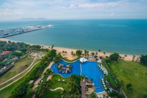 an aerial view of a resort and the ocean at Movenpick Residences Pattaya with Ocean View in Na Jomtien
