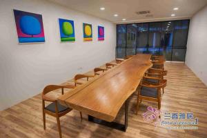 a conference room with a long wooden table and chairs at Floral Elegance1 @ Galacity in Kuching +13 photos