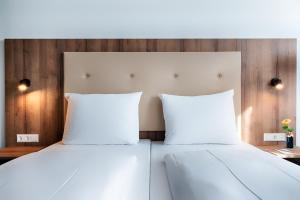 ACHAT Hotel Stuttgart Zuffenhausen 객실 침대