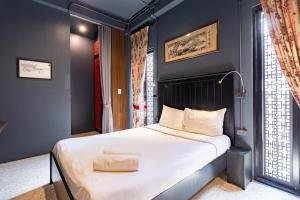 En eller flere senge i et værelse på CLOUD on Saladaeng Silom Hostel Bangkok