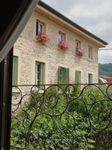 a view from the balcony of a building with flowers at Corte Tre Vigne in Marano di Valpolicella