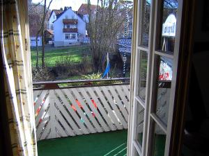 an open window with a view of a yard at Landgasthof & Landhaus Hofmeister in Diemelsee