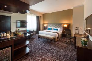Gulta vai gultas numurā naktsmītnē Golden Tulip Doha Hotel