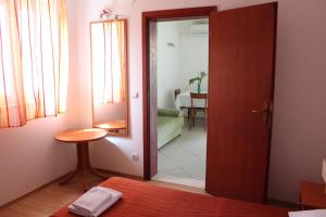 Postel nebo postele na pokoji v ubytování Apartments T & D