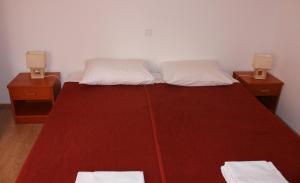 Postel nebo postele na pokoji v ubytování Apartments T & D
