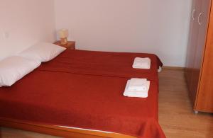 Postel nebo postele na pokoji v ubytování Apartments T & D