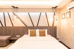 a bedroom with a large bed in a room at Tree Place in Bangkok