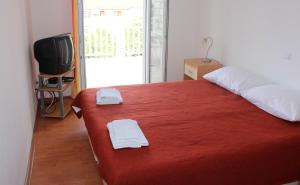 Postel nebo postele na pokoji v ubytování Apartments T & D