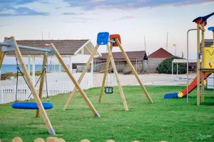 a group of playground equipment in a yard at Golden Tulip Taj Sultan Resort in Hammamet