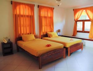 Postel nebo postele na pokoji v ubytování Eva Lanka Hotel - Beach & Wellness