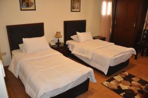 Uma cama ou camas num quarto em Best View Pyramids Hotel