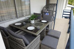 a table and chairs sitting on a balcony with a table and chairs at Central Views in Jurien Bay