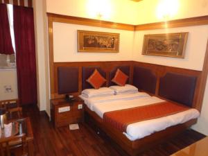 Postel nebo postele na pokoji v ubytování Hotel Lal's Haveli