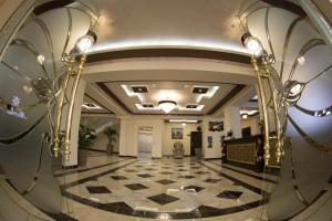 a view of a lobby with a marble floor at Marhabo Hotel Palace in Solnechnyy