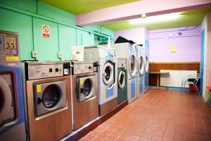 a row of washing machines in a laundry room at Portree Independent Hostel in Portree