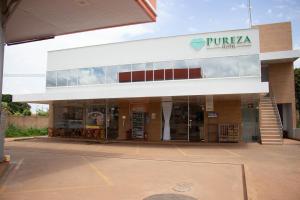 a pruka store with a sign on the front of it at Pureza Hotel in Timon