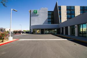 an empty parking lot in front of a building at Holiday Inn Victorville, an IHG Hotel in Victorville