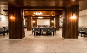 a dining room with a table and chairs at Holiday Inn Victorville by IHG in Victorville