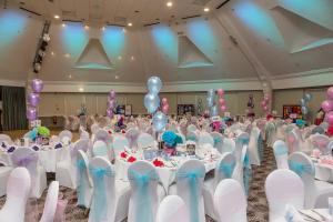 a room filled with tables and chairs with balloons at Holiday Inn Norwich North, an IHG Hotel in Norwich