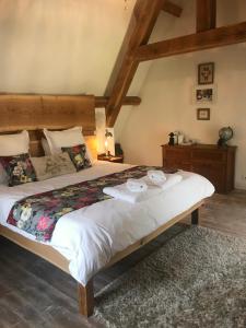 a bedroom with a bed with two dishes on it at Le Relais des galets in Domme