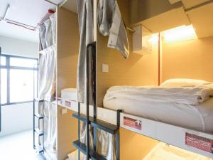 Postel nebo postele na pokoji v ubytování K2 Guesthouse Central