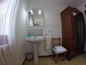 a bathroom with a sink and a mirror at Casa Margarita in Sóller