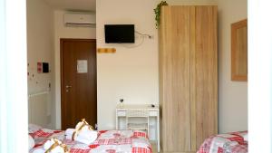 Postel nebo postele na pokoji v ubytování La Lanterna Sul Comò