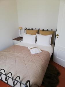 En eller flere senge i et værelse på Quinta da Varzea